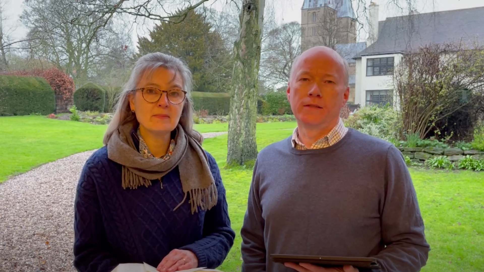 Bishop Paul and Sarah in garden with bible
